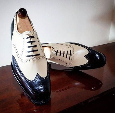 white and black leather shoes